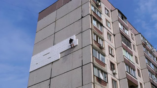 Industrial Climber Insulation of Facade Old High-Rise Building Using Styrofoam