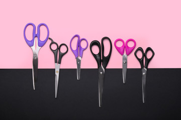 Scissors for paper on color background