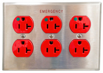 A brushed metal plate with six red emergency power outlet plugs on white background. Used in...