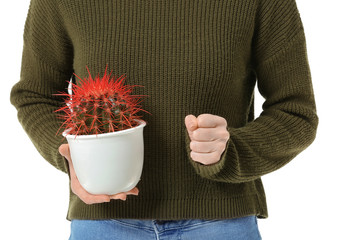 Young woman with cactus on white background. Hemorrhoids concept