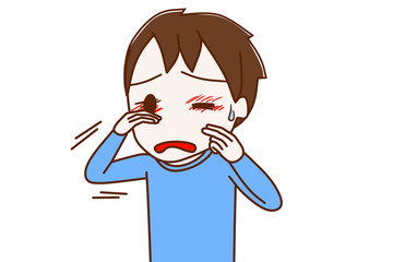 アレルギーで目が痒い少年