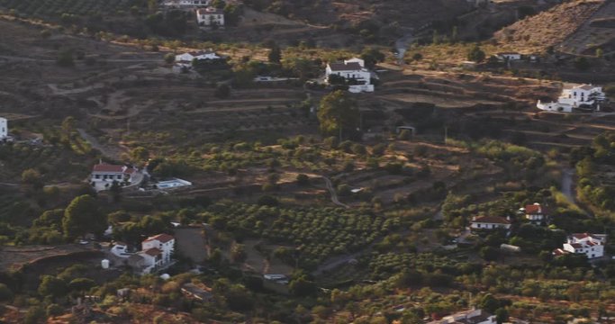 Long shot of cortijos and countryside villas near Lubrin, Spain by sunset.