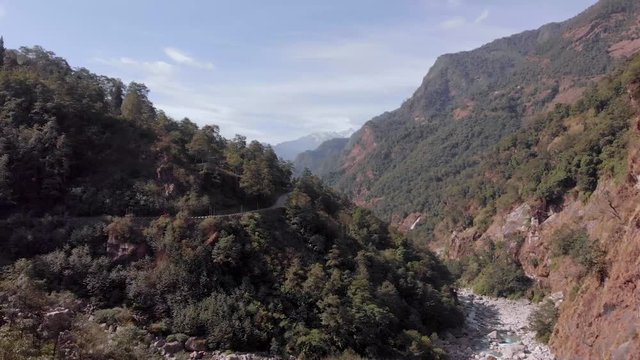 Aerial drone shot of valley near Mangan with Himalayas in the background, Sikkim, India.