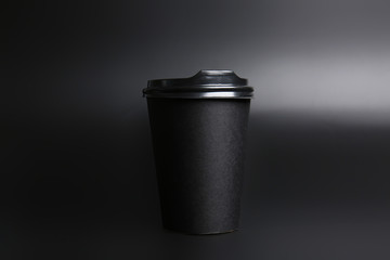 Takeaway cup for drink on dark background
