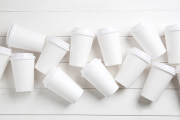 Many blank cups on white table