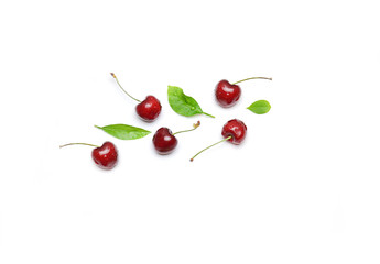 cherry and leaves on a white background selective focus