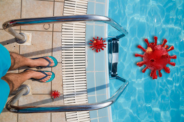 covid-19 coronavirus in swimming pool man feet staying before dive in summer holidays