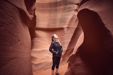 Young woman admiring Mother Nature's red canyon