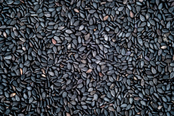 Roasted black sesame seeds  background.