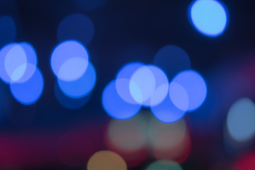 Natural blue bokeh, soft color tone, black surface.