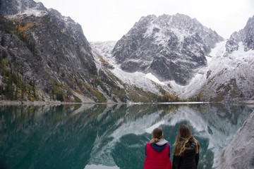 Friends taking in the mesmerizing mountain/lake view
