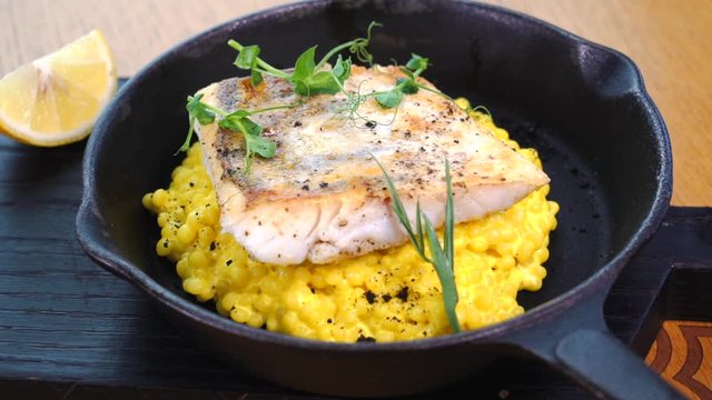 Fish dish with a side dish. Serve a dish of white fish fillet. Beautiful fish dish. Restaurant's menu. Food styling.