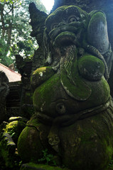 Art sculpture and carved antique deity angel god of hindu statue balinese style in Mandala Suci Wenara Wana or Ubud Sacred Monkey Forest Sanctuary at Ubud city in Bali, Indonesia
