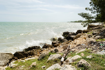 Fototapeta na wymiar Sea Waves Against Shore Rocks