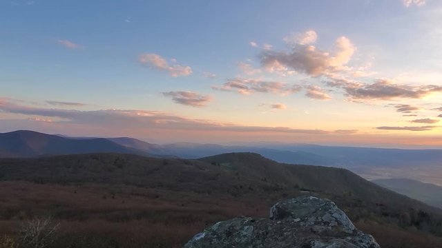 Mountain range during sunset stock