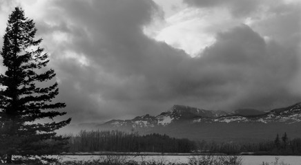 Black and white photo of mountains and clouds