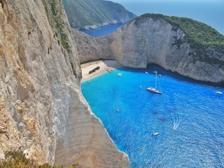 Fototapeta premium Beautiful panoramic view from the rock to the famous Navagio Ship Wreck, Zakyntos island, Greece.