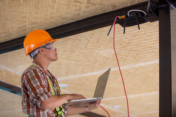 Technicians check the IP settings of the internet router system in the building with a lab.