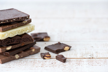 Different kinds of chocolates with nuts cocoa powder and mint