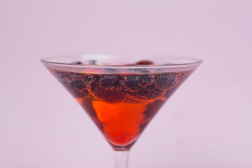 Berry cocktail with a pink background