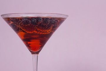 Berry cocktail with a pink background