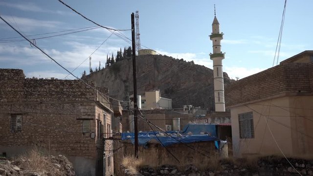 Iraqi Kurdistan. Primitive and Ruines Houses and Mosque Minaret in Small Countryside City