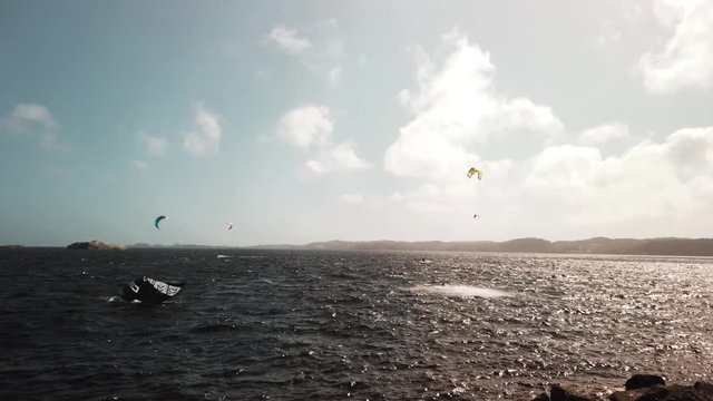 Kitesurfer jumps then falls into the ocean