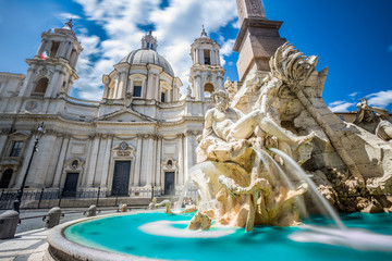 Fountain of rivers in Rome in Italy. In the background, the baroque church of Santa Agnese in Agone.