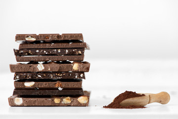 Different kinds of chocolates with nuts cocoa powder and mint