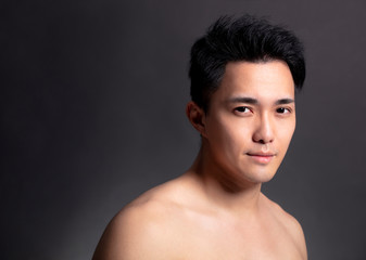 Fototapeta na wymiar Closeup of attractive young asian man face