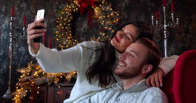 Caucasian couple or family making a selfie during Christmas holidays at home, 4k slow motion