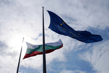 EU and Bulgaria flags waving in the wind against sky