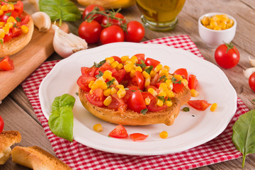 Friselle with tomatoes and mais.
