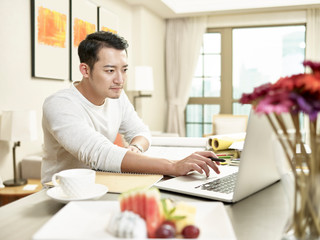 young asian business person working from home