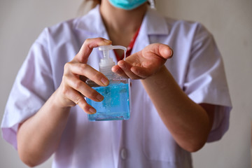 A female doctor with a alcohol gel in her hand