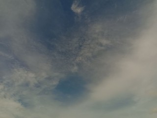 black and white clouds with blue sky
