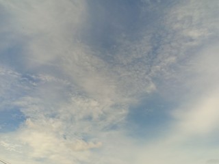 black and white clouds with blue sky