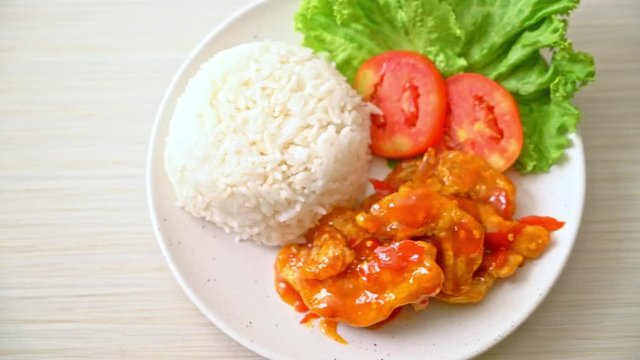 Fried fish topped by three flavors chili sauce with rice