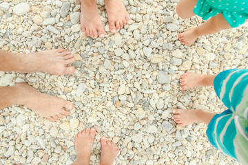 beautiful legs in the sand of the sea greece background