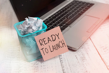 Text sign showing Ready To Launch. Business photo showcasing an event to celebrate or introduce something new to market Metallic laptop sticky note pad waste basket crushed paper vintage table