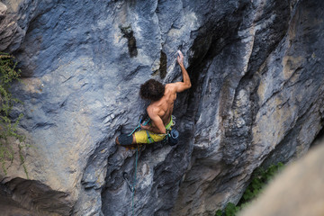 A strong man climbs a rock, Rock climbing in Turkey.