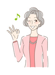  笑顔でOKサインを出す女性