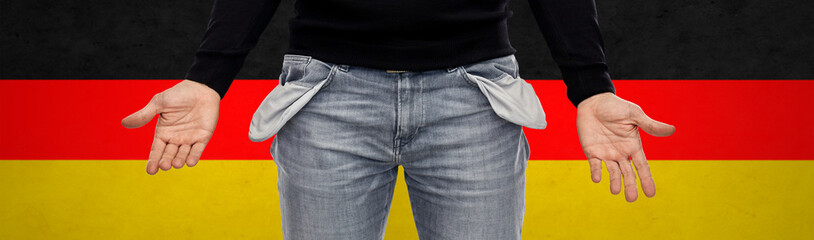 bankruptcy, financial crisis and poverty concept - close up of man showing empty pockets over...