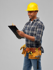 profession, construction and building - thinking indian worker or builder in helmet with clipboard...