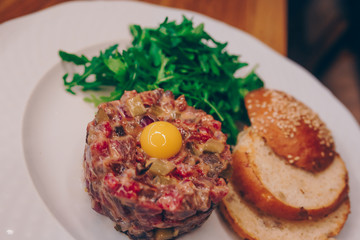 Waiter serving rogout stew with vegetable Salad Egg  at restaurant, close up view. Eating and leisure concept. Selective focus. Design Organic  Gourmet and luxury concept service 