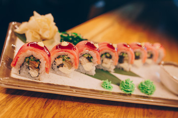 Large set of Sushi Rolls Warm Ebi Sake Unagi Spring. A lot assortment Philadelphia roll Dishes from Japanese raw fish  in one plate in traditional restaurant. Japan food menu service