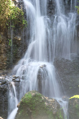 Fototapeta na wymiar waterfall in the forest wallpaper background
