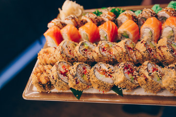 Large set of Sushi Rolls Warm Ebi Sake Unagi Spring. A lot assortment Philadelphia roll Dishes from Japanese raw fish  in one plate in traditional restaurant. Japan food menu service