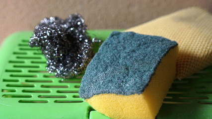 Shredded dishwashing liquid on a green plastic