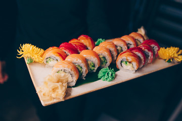 Large set of Sushi Rolls Warm Ebi Sake Unagi Spring. A lot assortment Philadelphia roll Dishes from Japanese raw fish  in one plate in traditional restaurant. Japan food menu service